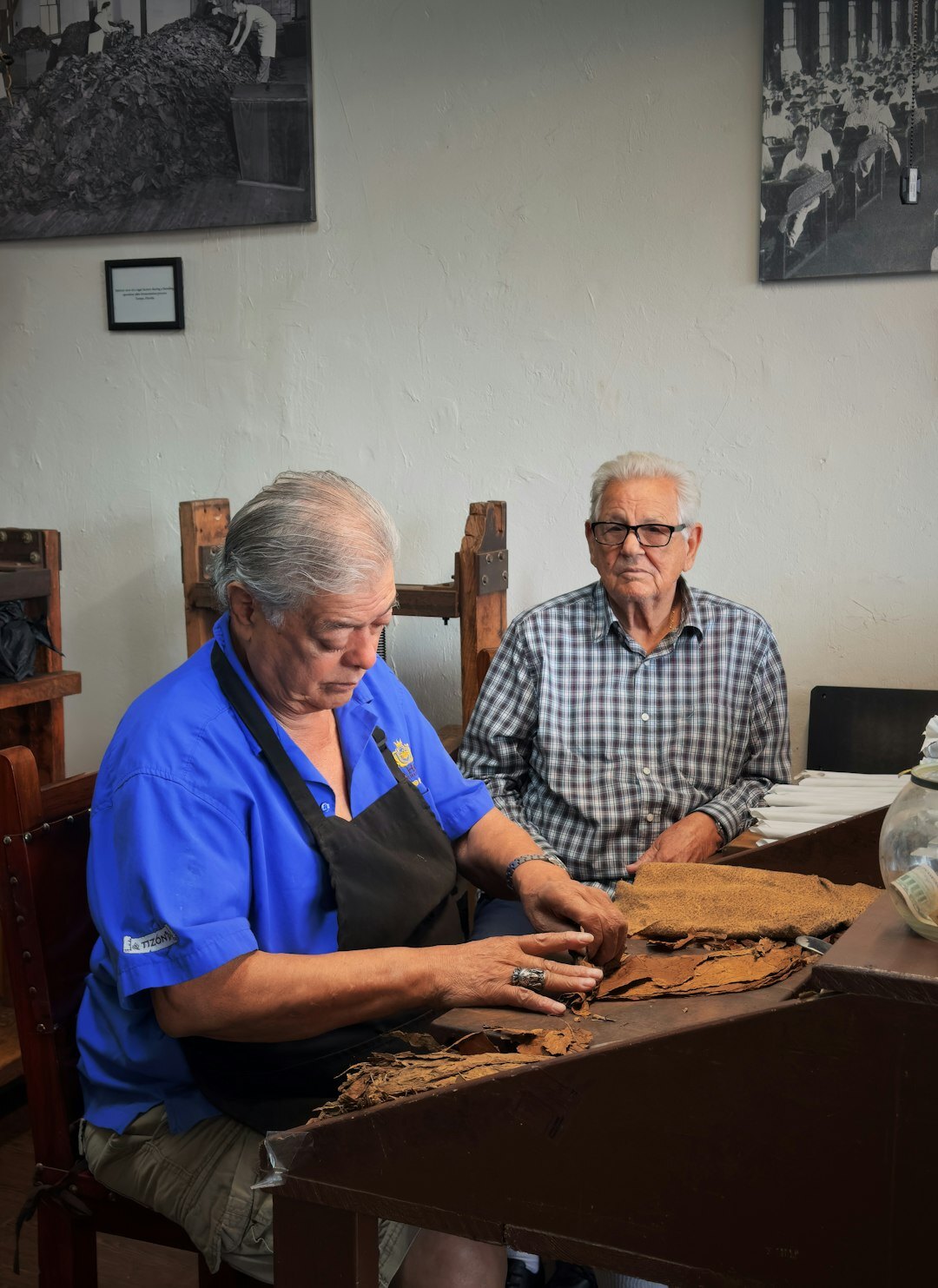 Seniors making handicrafts together at a craft workshop table