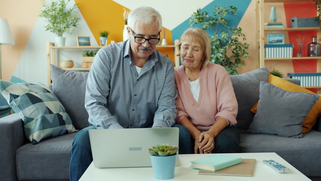 Senior Croatian couple looking at a laptop together at home