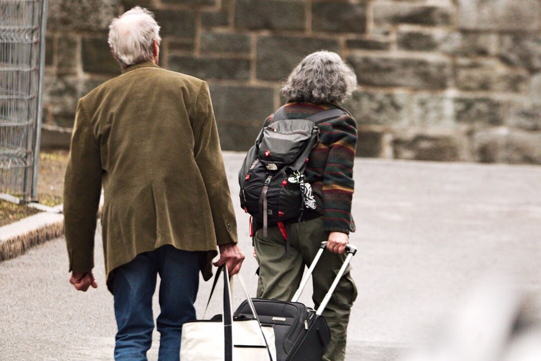 senior couple packing luggage