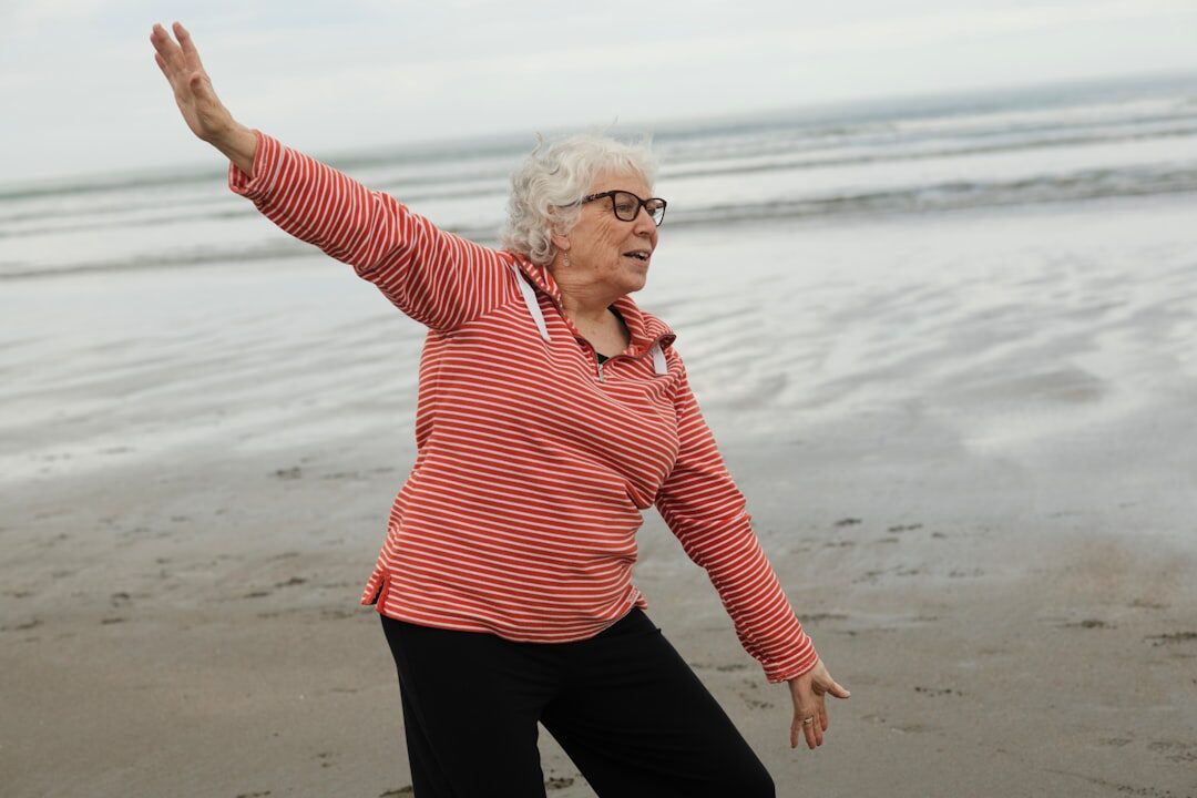 senior doing yoga outdoors