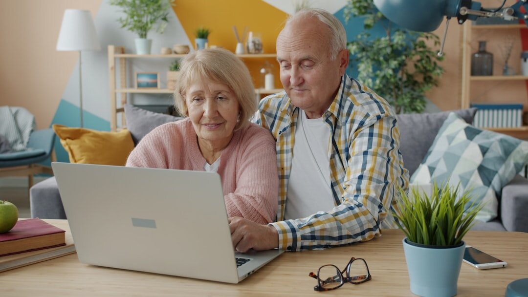 senior couple reviewing budget papers